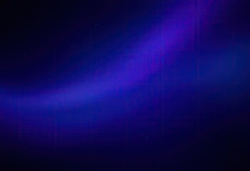 A dark blue and purple abstract image featuring a diagonal streak of light, resembling a cosmic or atmospheric phenomenon, speckled with faint, 