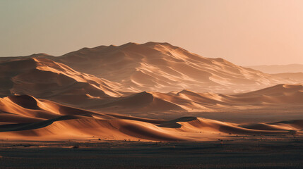 A desert with large sand dunes at golden hour