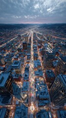 Obraz premium Aerial view of a snowy city glowing with warm holiday lights at dusk with traffic and festive ambiance perfect for winter celebration visuals and New Year season campaigns