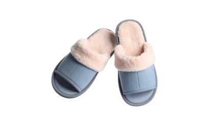 Pair of cozy blue home slippers with soft pink fur on transparent background