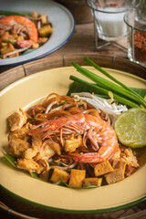 Pad Thai Pad Thai with rice vermicelli and shrimp placed on the table