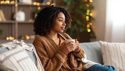 Woman relaxes with coffee at home.