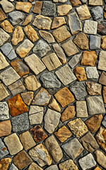 Fototapeta premium A close up view of a stone wall with varying shapes textures and colors creating a rustic appearance