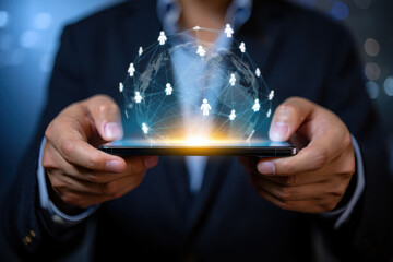 Person holding a phone with a digital globe and stick figure icons displayed on the screen