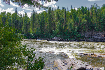 View of the raging rapids of the Kazyr River. Near Kuragino, Russia