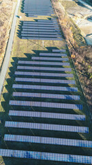 Fototapeta premium Vertical aerial photo of solar panel rows