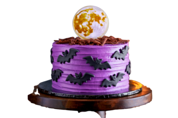 Purple Halloween Cake with Flying Bat Decorations and Full Moon
