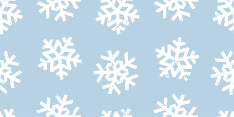 Seamless abstract horizontal winter Christmas pattern of big paper snowflakes on blue background, chalk texture; simple hand drawn cute vector illustration, flat style