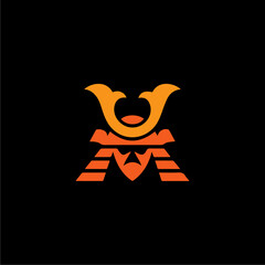 Obraz premium Orange samurai helmet icon with stylized design on a black background.