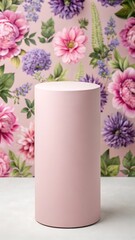 A soft pink cylindrical pedestal stands elegantly in front of a vibrant floral wallpaper background isolated on white background