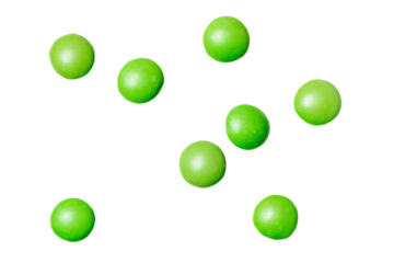 a group of green apples are flying in the air