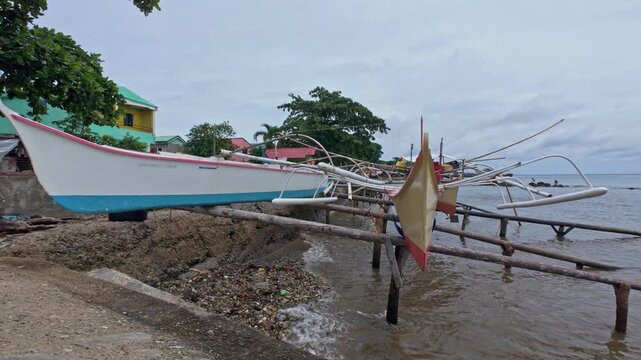 Traditional wooden outrigger banka boats in the Philippines