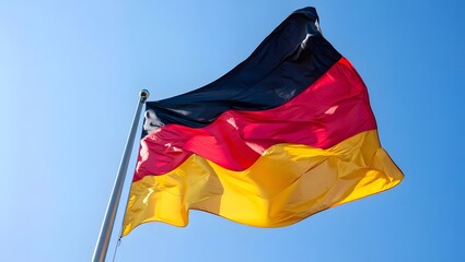 Waving German Flag Against Blue Sky - National Identity, Pride, Patriotism