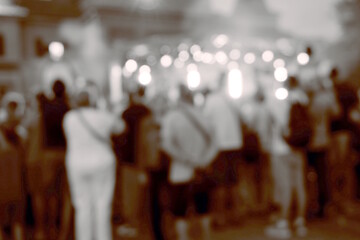 Blurred background. A city festival with people. Tinted image.