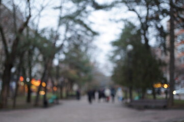Blurred background. A street in the city in the evening.