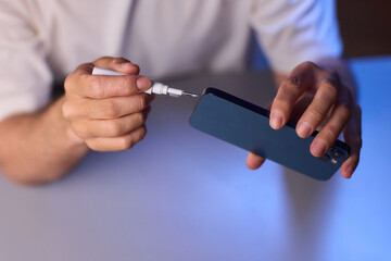 The Innovative Smartphone Cleaning Device is Being Demonstrated During Use and Functionality