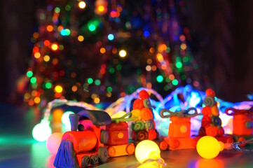 A toy train made of plasticine and Christmas lanterns. Festive decorations.