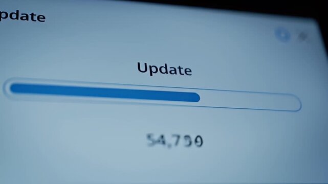 Computer screen shows an update progress bar nearly halfway completed in blue