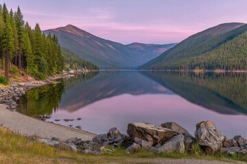 Serene mountain lake at dawn.  Peaceful shoreline with reflections