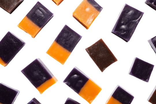 a group of squares of purple and orange candy