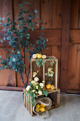 Wooden interior decor with flowers and lemons.