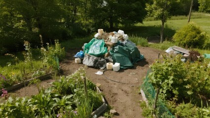 Obraz premium Piles of household waste dumped near the house