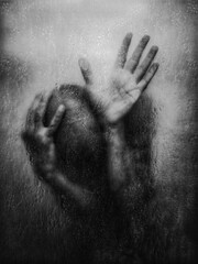 Silhouette behind foggy glass, hands pressed, emotional tension.
