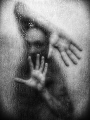 Silhouette behind foggy glass, hands pressed, emotional tension.