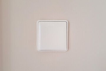 White Wall-Mounted Switch Panel in Home Interior. switch in a modern home interior