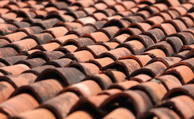 The roof is made of red tiles and has a rustic appearance