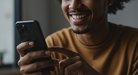 A young man with a beaming smile engrossed in his smartphone application and modern lifestyle