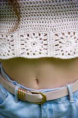 bell young woman in jeans and handmade top
