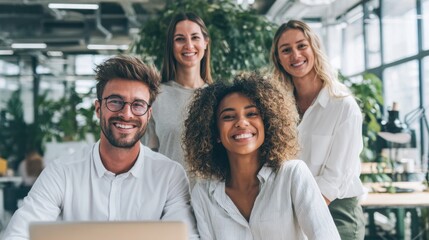 Fototapeta premium Diverse Group of Four Happy Business People Smiling in Modern Office Environment.