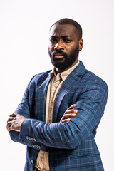 Close up portrait of worried and thoughtful businessman. Black man in business suit is standing and...