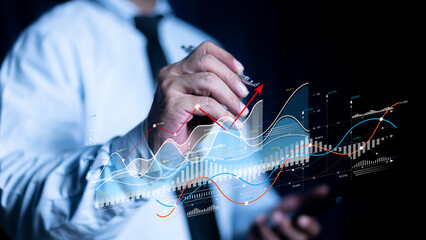 Businessman using pen touch holographic graphs and stock market statistics gain profits. Stock market price increase. Stock market investment analysis, financial risk management and investment.