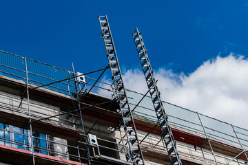 Construction site with scaffolding under blue sky