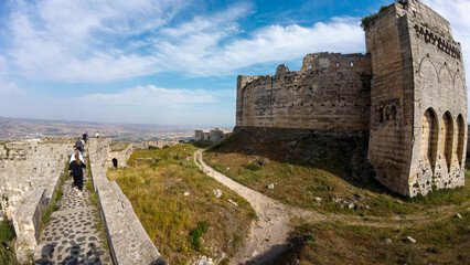 Tourists Exploring Ancient Fortress Ruins Krak des Chevaliers castle, Syria