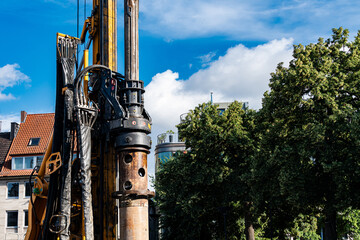 Construction equipment operates under a clear sky
