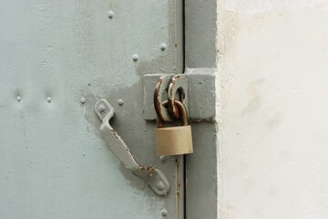 Old rusty steel door and padlock background