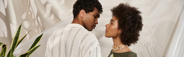 Loving couple sharing a tender moment in a stylish indoor setting with aesthetic vibes
