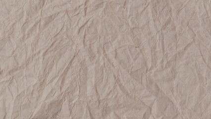 Crumpled kraft old brown paper texture background with copy space for design. Crumpled old brown vintage paper surface texture for background.