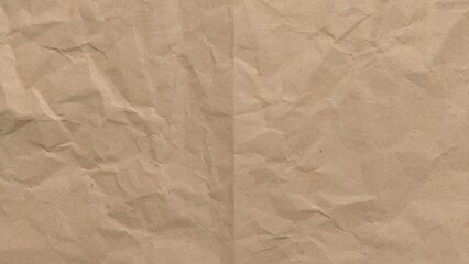 Crumpled kraft old brown paper texture background with copy space for design. Crumpled old brown vintage paper surface texture for background.
