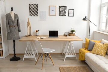 Home office setup with desk and laptop computer