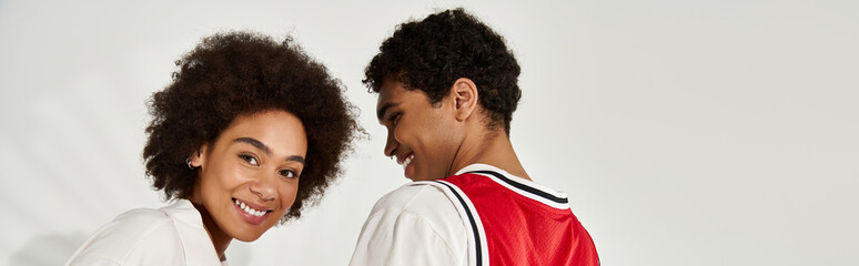 Young couple sharing a joyful moment together in a stylish and aesthetic setting