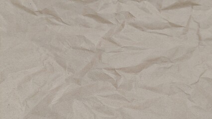 Crumpled old rough brown paper background with natural folds and creases. Crumpled old brown...
