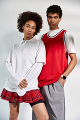 Stylish young couple poses together in casual fashion for a modern aesthetic look