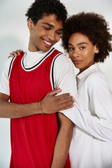 Young couple enjoying playful moments in a stylish and modern setting
