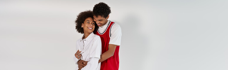 Young couple radiating love and style in a minimalist setting together during a joyful moment