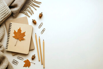 Flat Lay of Autumn Stationery with Notebooks, Pencils, and Leaves on Cosy Background, back to school concept