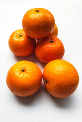 Vibrant Mandarin Oranges on a Clean White Background